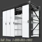 Overhead track floating aisle compact shelving storage