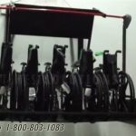 Overhead wall wheelchair lift storage racks