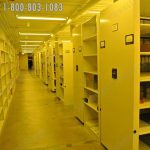 Powered mobile library archives shelving