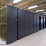 Rolling armory racks on tracks gsa high density mobile storage shelving military weapon storage