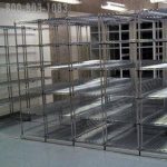 Rolling wire storage shelves moving on rails