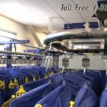 Rotating garment conveyors correctional facilities