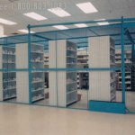 Secure pharmacy storage shelving behind mesh cage