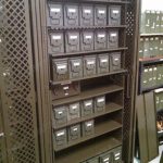 Secured ammo storage cabinet rack with retractable locking doors weapons locker