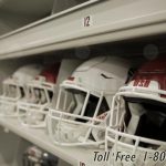 Shelves storing football helmets