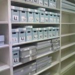 Shoe storage museum cabinet acid free boxes on shelf artifact