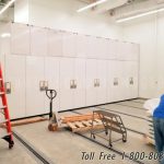 Space saving museum cabinet sliding shelving