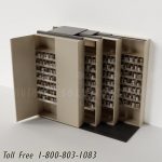 Space saving pharmacy shelving on tracks