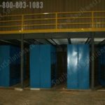 Stationary shelving storage below warehouse mezzanine industrial
