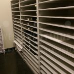 Storing archival quality works on paper solander case shelves