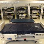 Storing hospital beds vertically saves space
