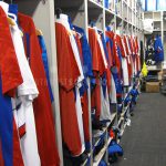 Uniform storage team sports university athletic equipment shelving
