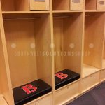 University locker room football player game day gear storage lockers