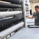 Vertical rotating shelves storing long textile rolls fabrics upholstery