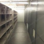 Warehouse high density shelving tracked storage system on tracks