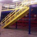Warehouse mezzanine storage space second level over shelving