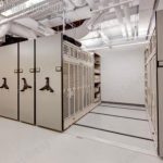 Weapons cabinets on mobile shelving police armory storage