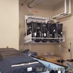Wheelchair powered wall lift storage rack system