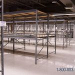 Wide span industrial shelving racks without stanchions adjustable
