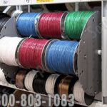 Wire spools on rotating vertical carousel for warehouse storage