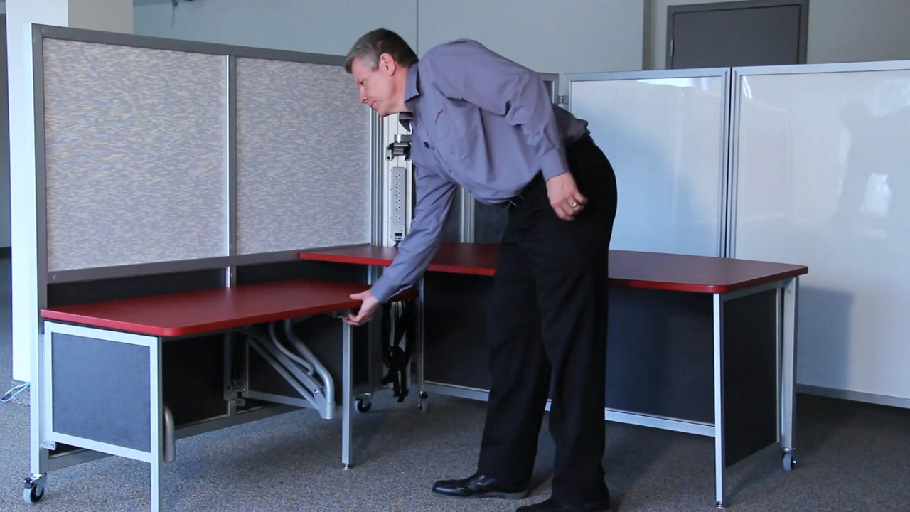 Movable adjustable height worksurface