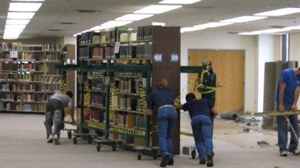 Moving loaded library shelving rs