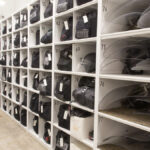 riot shield storage with labeled shelving for organized police protective equipment