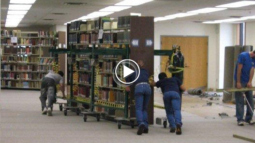 Moving Loaded Library Book Shelving