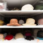 museum shelving storing hats purses