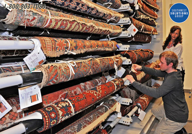 rolled rug textile storage racks museum