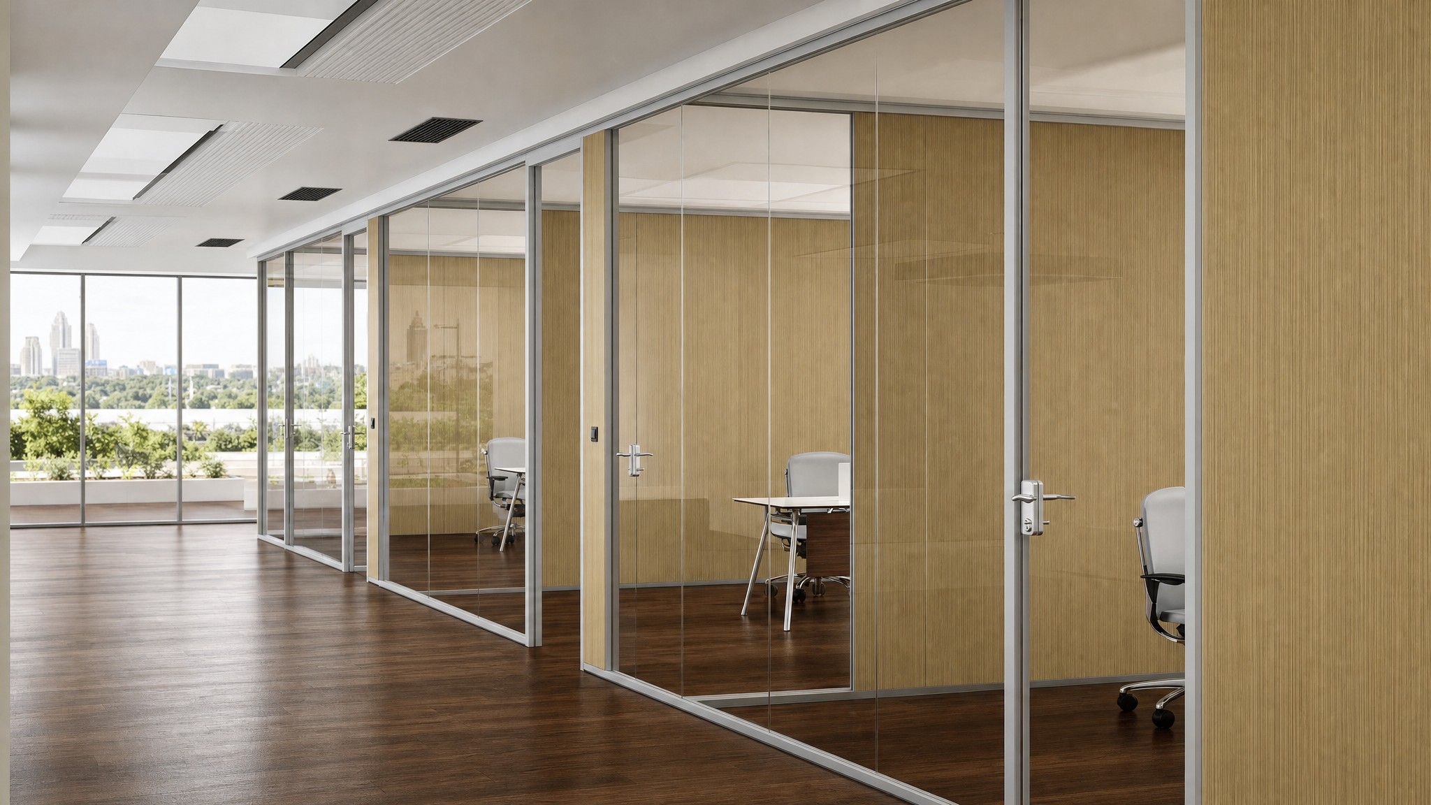 Frameless glass walls with aluminum frames dividing offices with wood paneling.